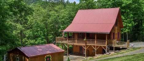 Beside the Still Waters- side of log cabin.