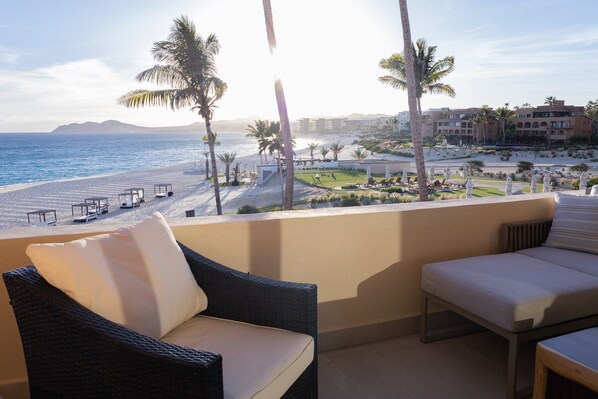 View from deck with pergola, sofa, chairs,  dining table and new Weber Grill 