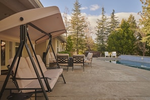 Backyard Oasis: Outdoor Lounge w/ Firepit & 3 seater swing chair.