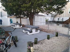 Backyard Area with Tables and Barbecue 
