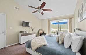Master bedroom with a balcony