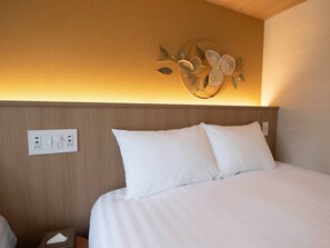 [A09,10 (Bedroom)] Conveniently equipped with an outlet and USB port by the bedside