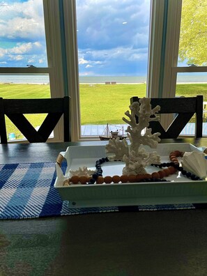 Dining room table seats 6, and has stunning views of the Bay.