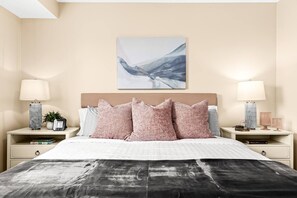 Indulge in the lavish comfort of our king-size bed, adorned with luxurious linens and plush pillows.