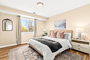 Experience the luxurious comfort of our king-size bed adorned with opulent linens and plush pillows.