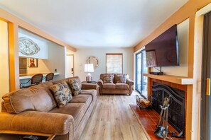 Living room has comfortable couches with a pullout sleeper sofa.