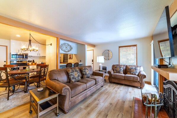Open living area with beautiful new flooring throughout.