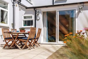 Open up the sliding door to the courtyard garden, and relax