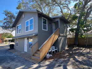 View of duplex and yard to be fenced on right side