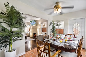 Gather around the table and enjoy delicious meals together in this inviting space designed for shared dining experiences.
