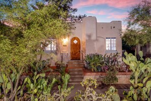 Front entrance nestled among desert beauties