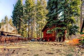 The fenced backyard is a great hang-out area to enjoy in the summer months and is perfect for those traveling with children giving them an additional space to run and play.