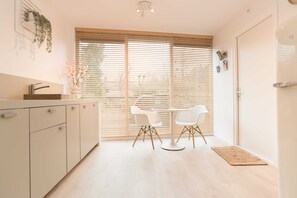 Charming dining spot by the window — enjoy breakfast with natural light and streed views