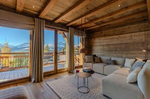 Cozy lounge area with log fire and West facing terrace