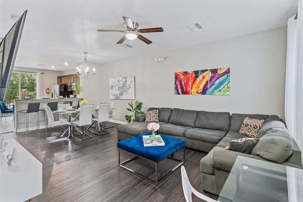 Living room with indoor fireplace and large smart TV