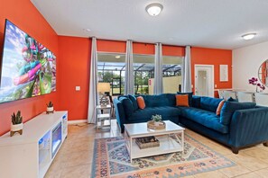 A colorful and playful vibe in the living room will never bore you. With this huge seating capacity, you will enjoy watching the shows, movies, games and more. Also an easy access to the pool.