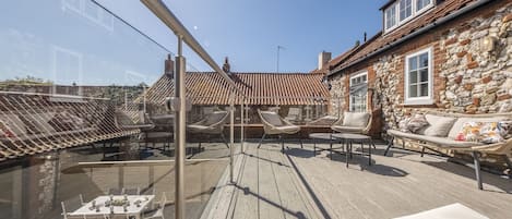 Duffields House, Brancaster: The glazed decked upper terrace