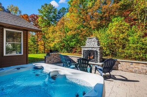 ave a dip in the hot tub on your private patio, or just relax by the stone fireplace while the dogs enjoy the fully fenced yard.
