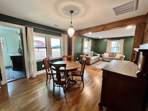 Dining room opens to living room and has an antique buffet for serving & storage