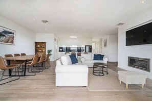 Gather your group for a memorable experience around the expansive dining table, or unwind and enjoy relaxation on the sofa by the indoor fireplace.