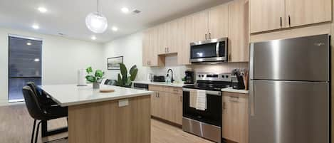 Kitchen + Island.  FULLY stocked with rice cooker, coffee machine, kettle, pots, pans and SO much more!