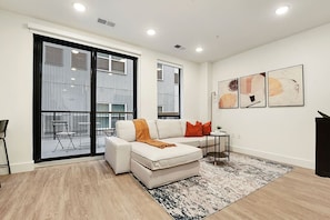 Open Concept Living Room. No Patio in This Unit, Large Windows Instead
