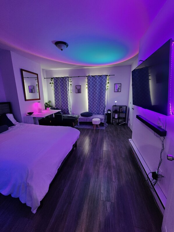 Ambient lights, Queen Bed, Smart TV, lounge chair, Adjustable table 