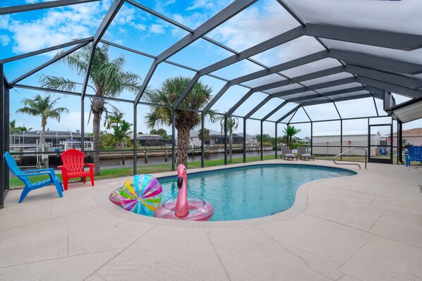 Get a view of the palm trees outside from the glass enclosures