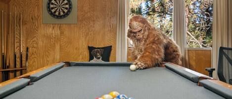 Bigfoot enjoying the pool table.