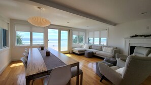 Main level dining and living area with access to the patio