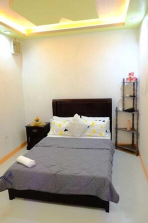 Our second bathroom includes a queen-sized bed, a long desk, and a cabinet. Sleep well!