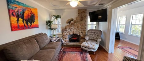 Living room with cobblestone fireplace