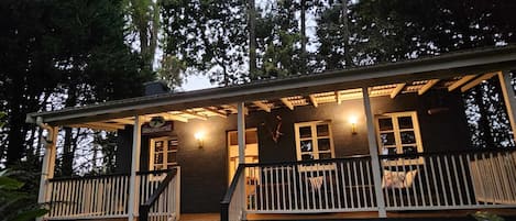 Entrance to the cottage. Large deck with BBQ and couch. Great for sunset!