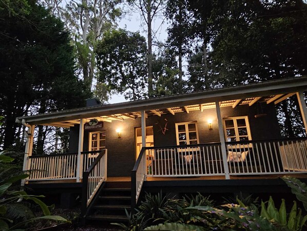 Entrance to the cottage. Large deck with BBQ and couch. Great for sunset!