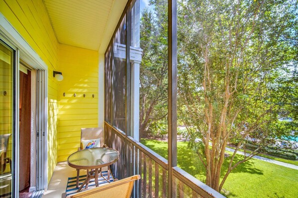 French doors leading to a private balcony. Backyard views offer unmatched tranquility
