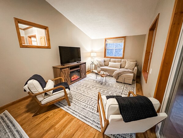 Secondary living room, located off of the kitchen next to the sun room.