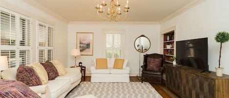 The light and airy living room has lots of space for friends and family