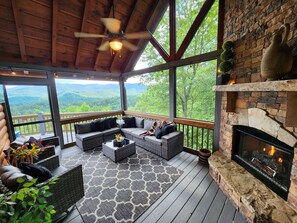 Screened in porch with gas fireplace and outdoor TV!