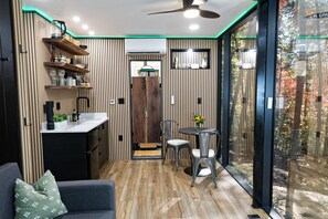 Savor every meal surrounded in nature in your kitchen, embraced by floor-to-ceiling windows.