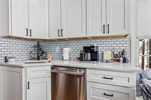 Enjoy a nice cup of coffee. The coffee maker is both drip and Keurig. It accepts standard filters. Extra 8-12 cup basket-style filters can be found in the kitchen cabinet.