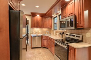 Stainless-steel refrigerator & dishwasher, flat-top stove/oven & microwave