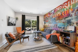 Cozy living room with plenty of seating, records to listen to and smart TV.