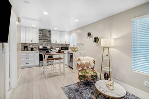 Table and chairs make for a comfortable work space, place to eat or play a board game.