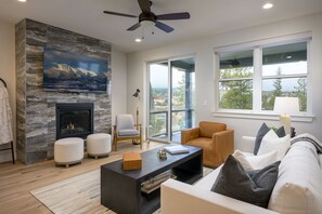 Gas Fireplace with a Beautiful Custom Tile Surround And Wall Mounted 65" Smart TV
