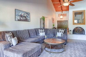 Open-floor formal living space with decorative furnishings. *Fireplace is not functional