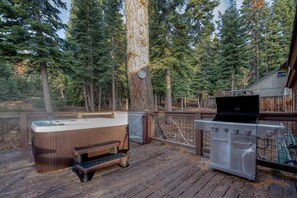 Soak sore muscles in the hot tub while taking in the views over the majestic pines.