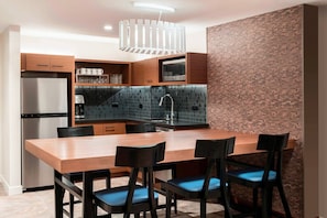Separate Dining area and Partial Kitchen. Includes everything except a stove or oven.