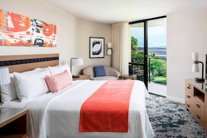 Primary Bedroom features a king bed, door to the balcony, and ensuite bathroom.