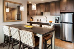 Separate dining area and partial kitchen.