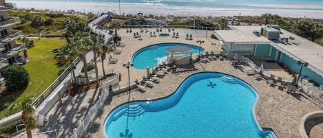 Enjoy a refreshing swim in the outdoor pool, surrounded by beautiful scenery and perfect for sun-soaked days.